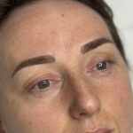 Close-up of combination brows with defined hairstrokes and soft shading
